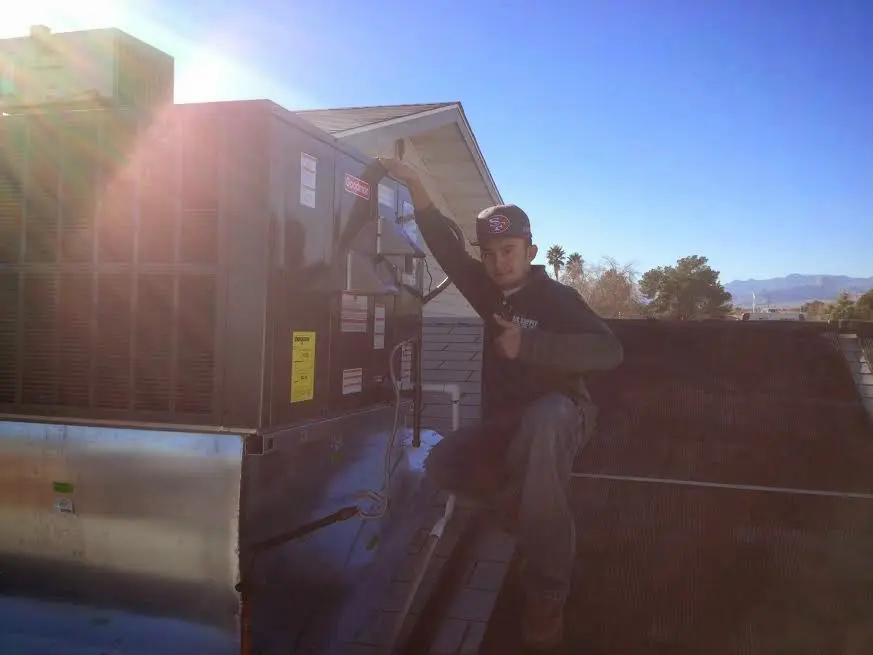 HVAC technician performing HVAC Inspection on a rooftop unit in East Stroudsburg